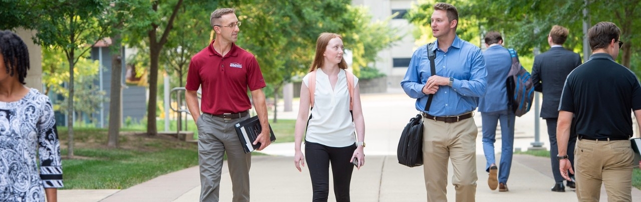 Chase students walking around together outdoors on NKU's campus.
