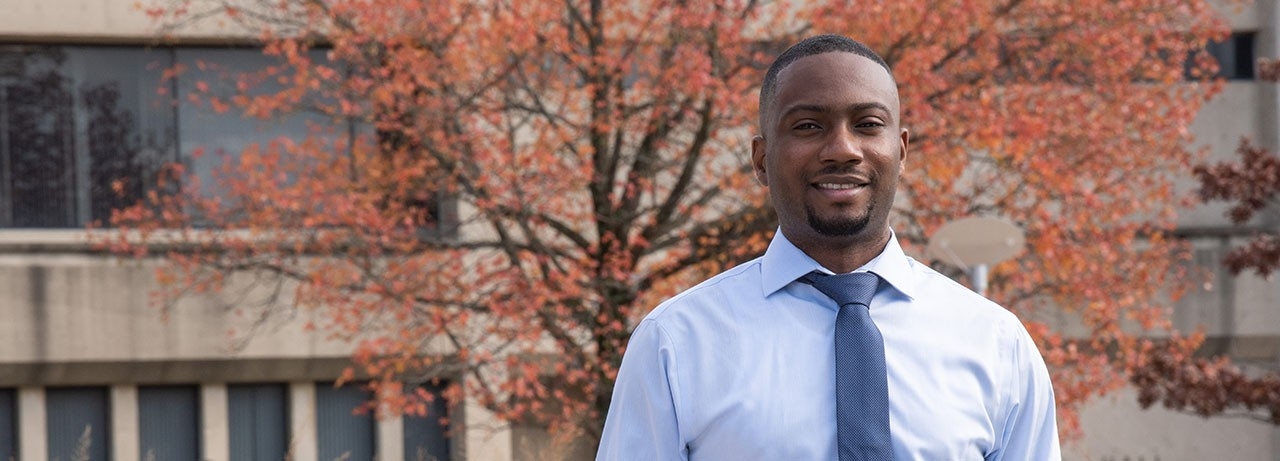Professionally dressed man smiling 