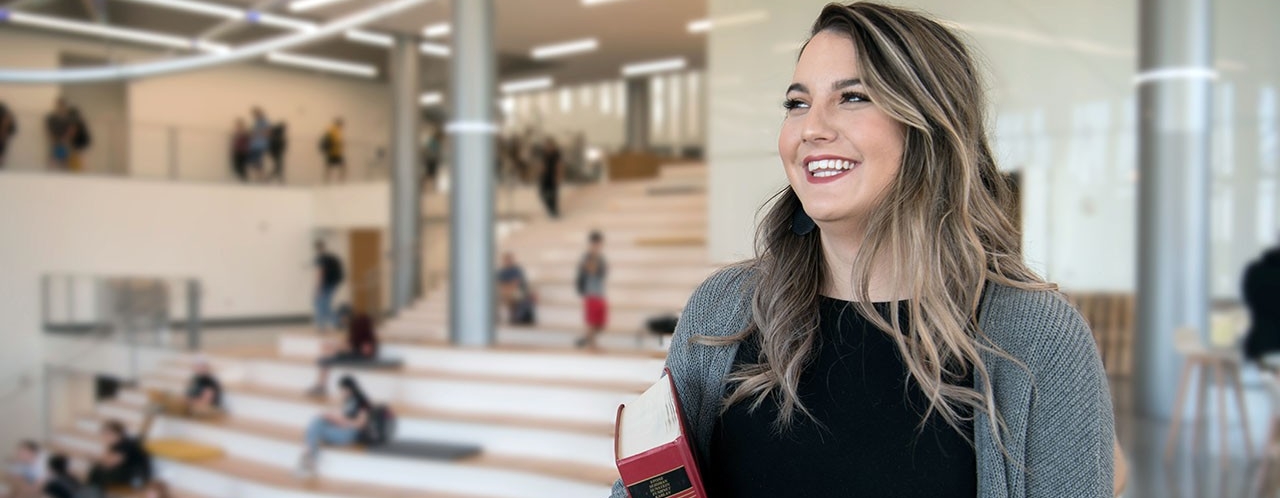 Professionally dressed woman smiling