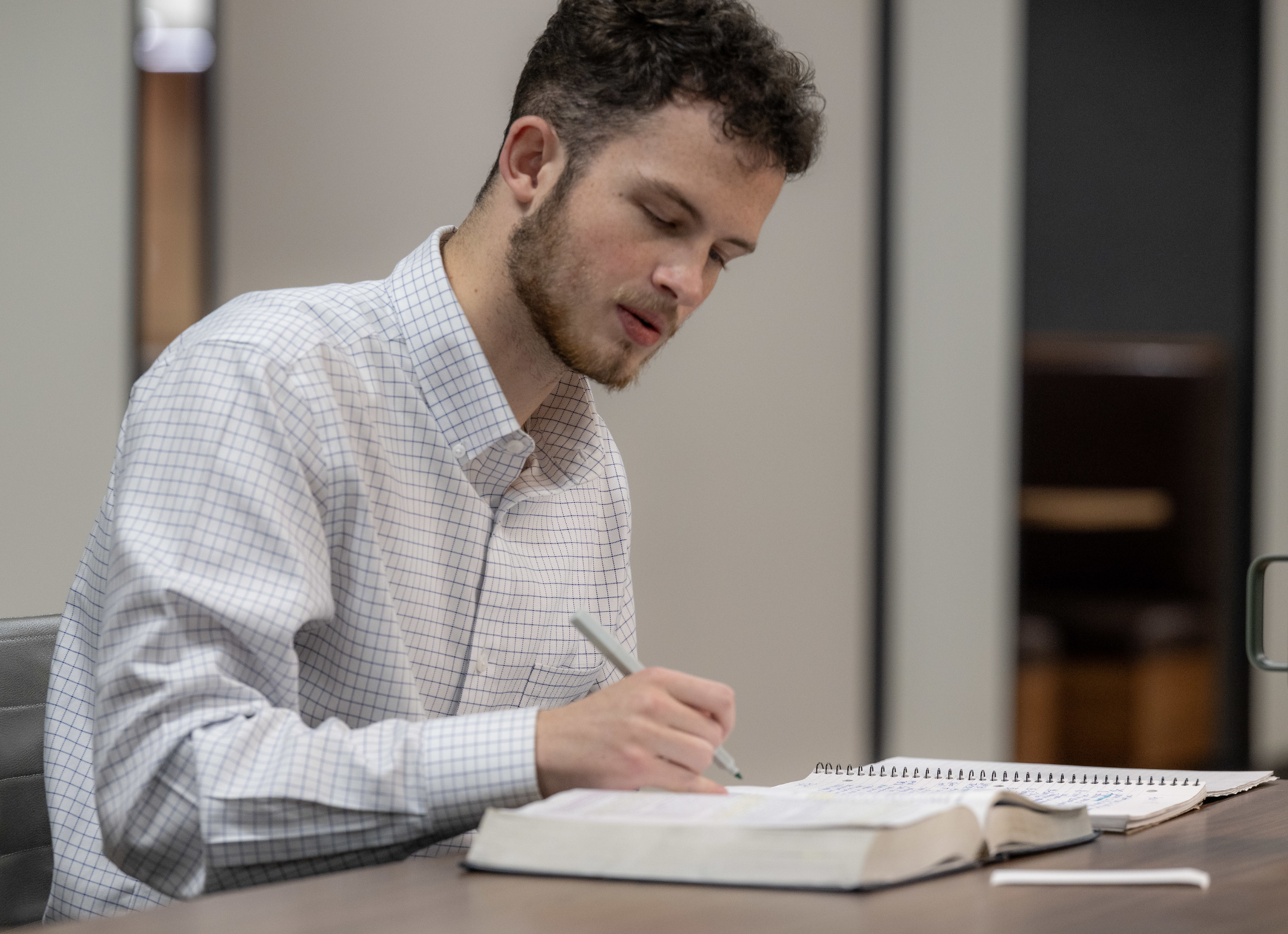 Chase Law Student working at desk.